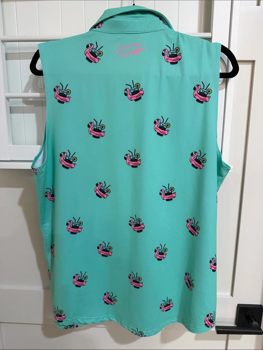 Sleeveless Mint Green Polo Tank with Pink Flamingo Float Motif. Great for golf